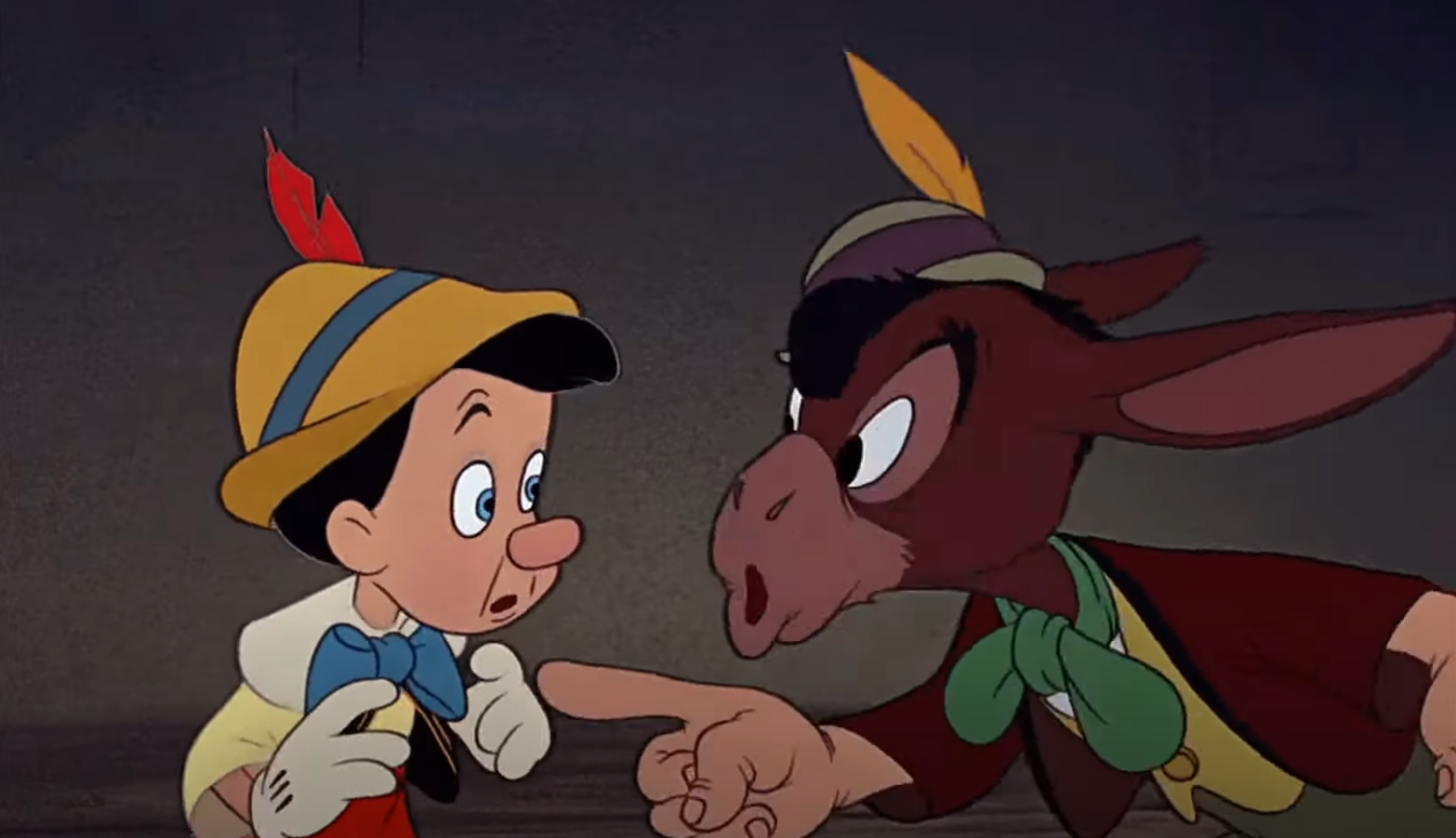 Pinocchio, a wooden puppet, looks surprised as a donkey character points at him, indicating a tense interaction