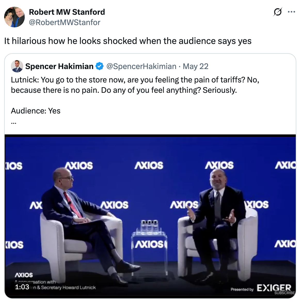 Two people on stage at an Axios event. One man reacts with surprise. Caption mentions reaction to audience agreement on tariffs