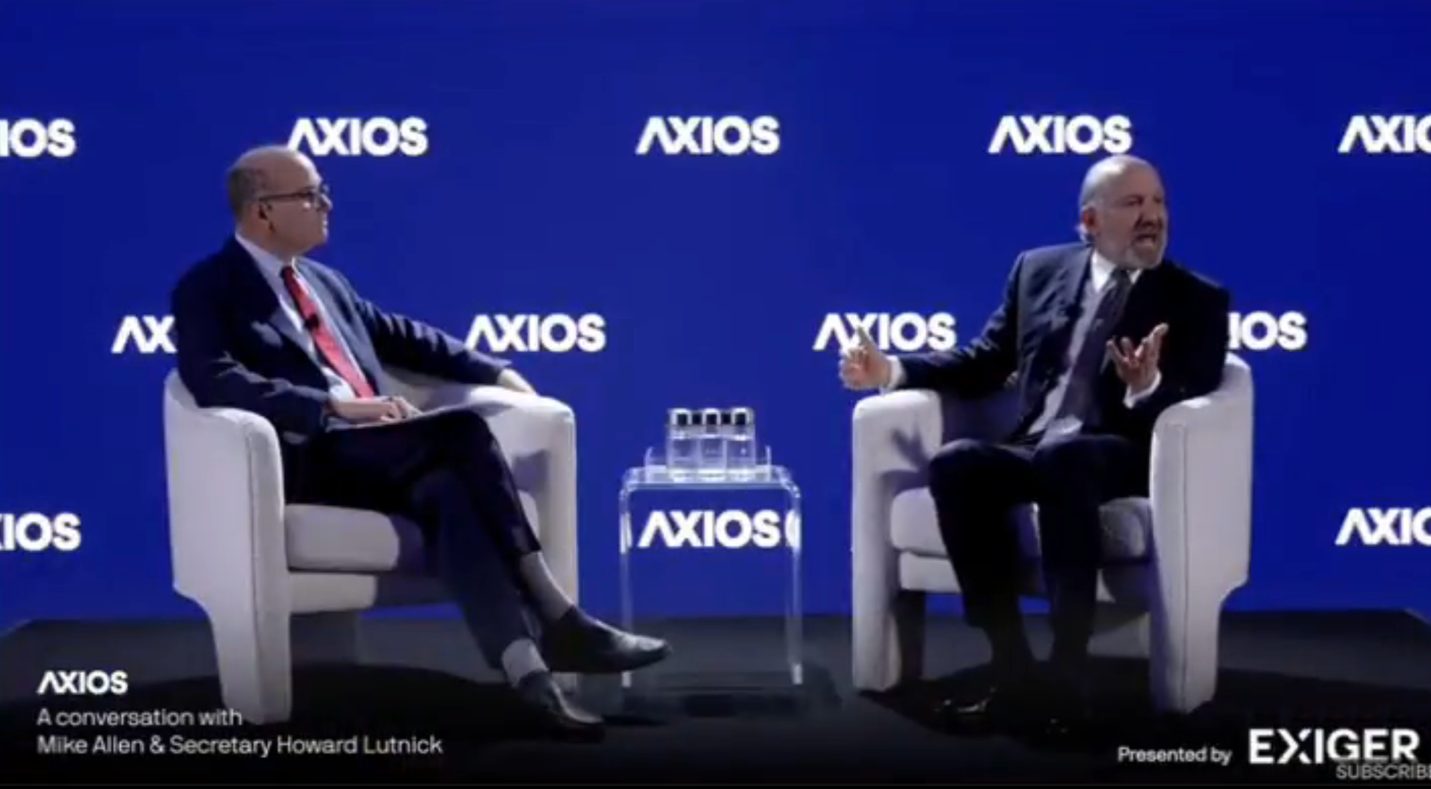 Mike Allen and Secretary Howard Lutnick seated on stage having a discussion at an Axios event