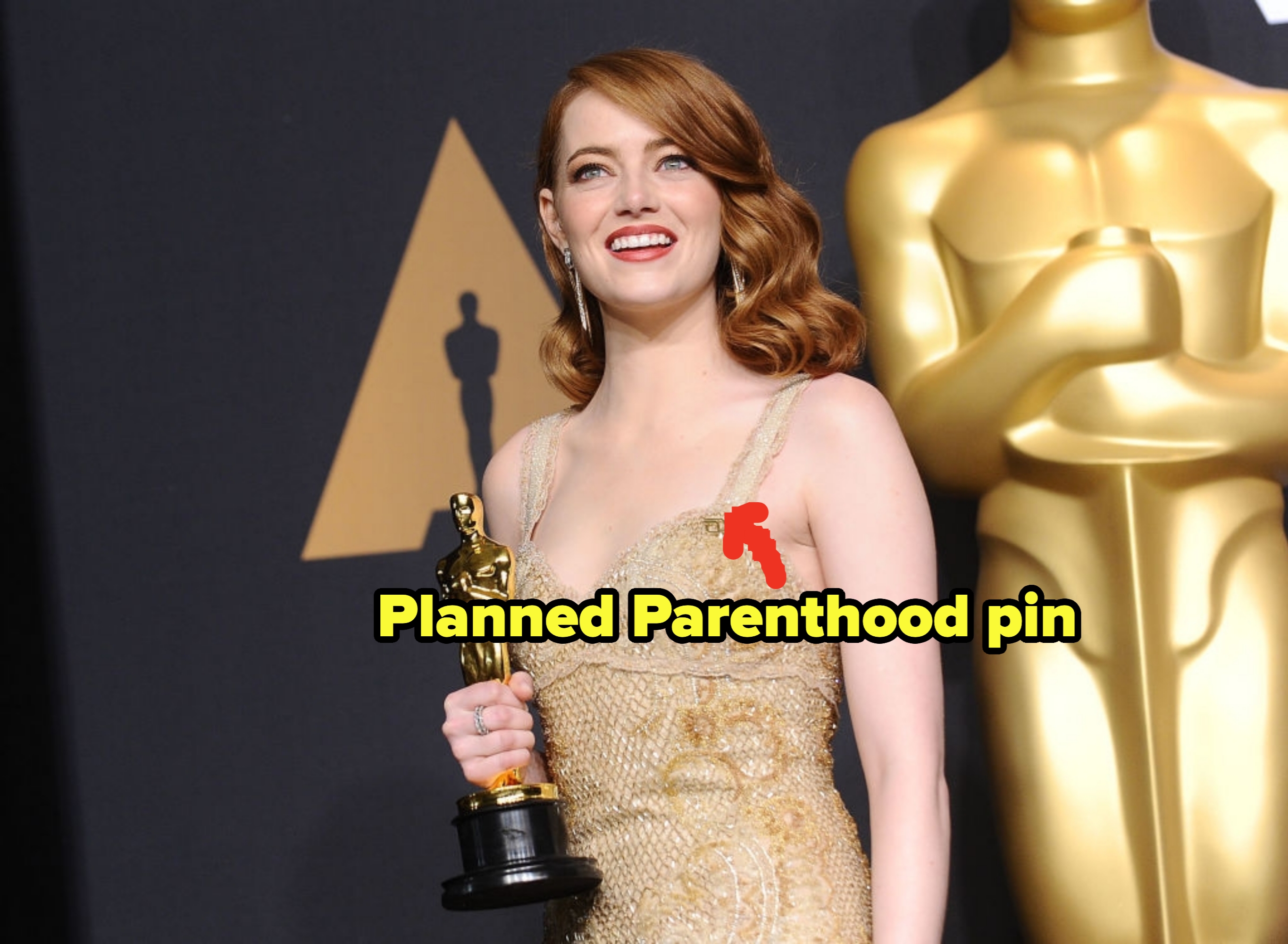 Emma Stone at the Oscars with a Planned Parenthood pin on her dress