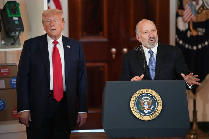 U.S. President Donald Trump listens as Commerce Secretary Howard Lutnick speaks in the Cross Hall of the White House during an event on &quot;Investing in America