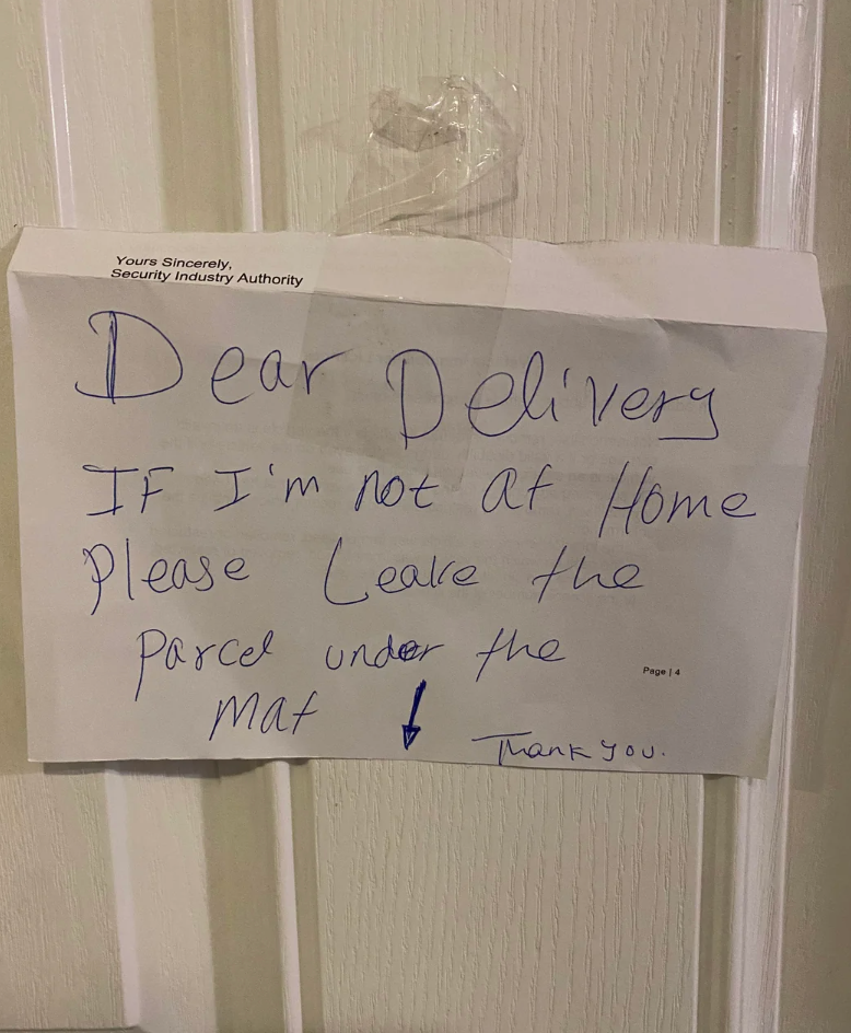Note taped to door reads: "Dear Delivery, if I'm not at home please leave the parcel under the mat. Thank you."