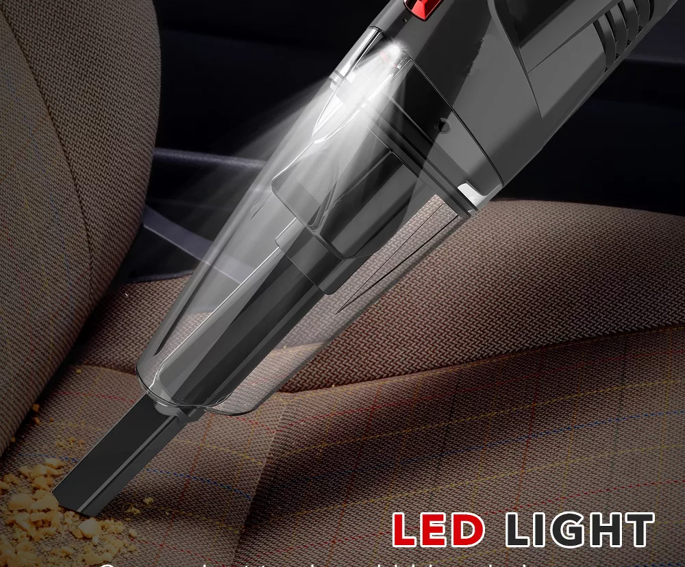 Handheld vacuum cleaning crumbs from a car seat, highlighting its LED light feature for cleaning dark corners
