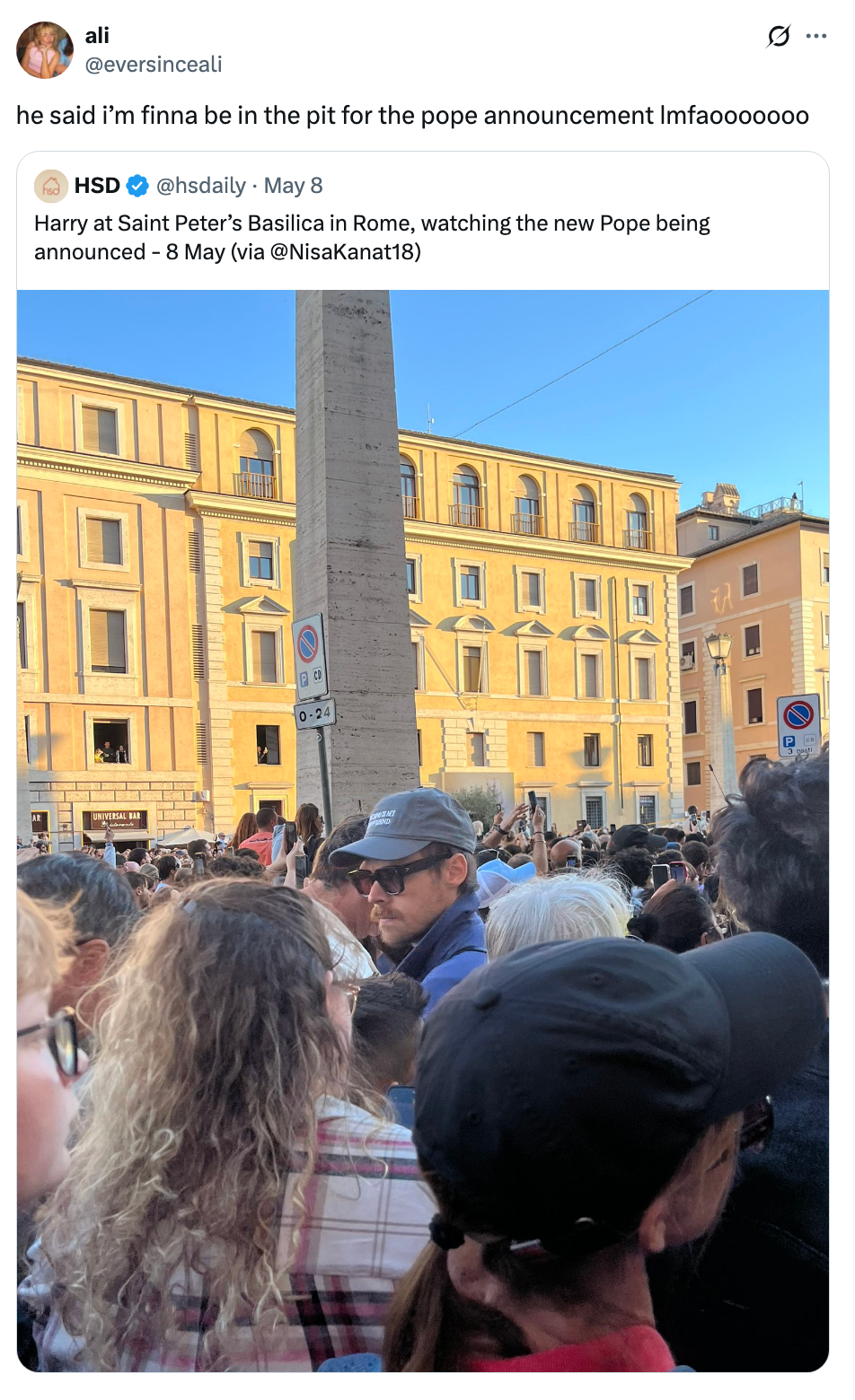 A crowd gathers at Saint Peter’s Basilica in Rome for the announcement of the new Pope, with people taking photos and videos
