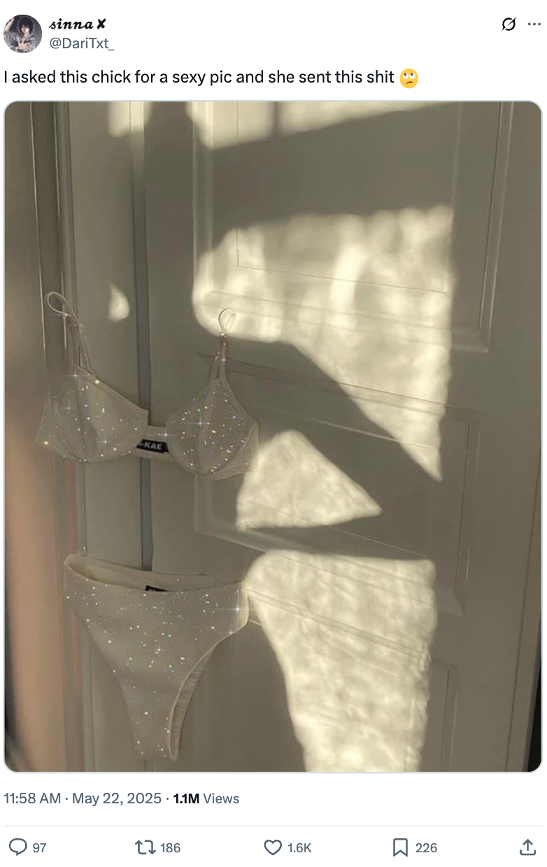 A bra and underwear set hangs on a door, casting shadows