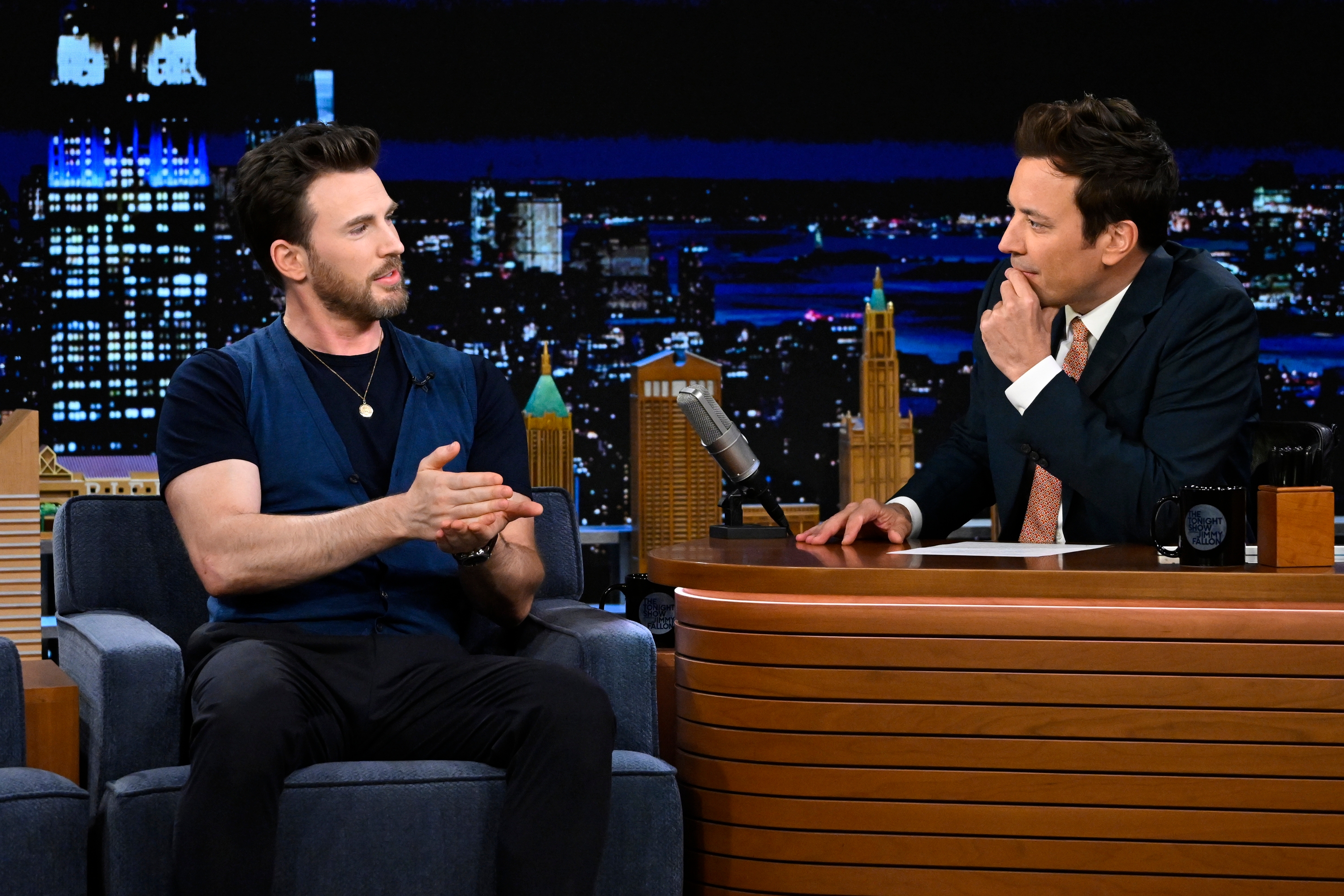 Chris Evans talks to Jimmy Kimmel on a talk show set