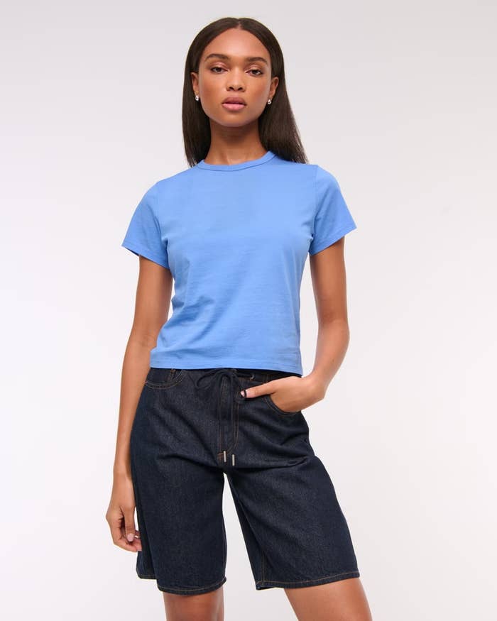 Model wearing the marine blue tee