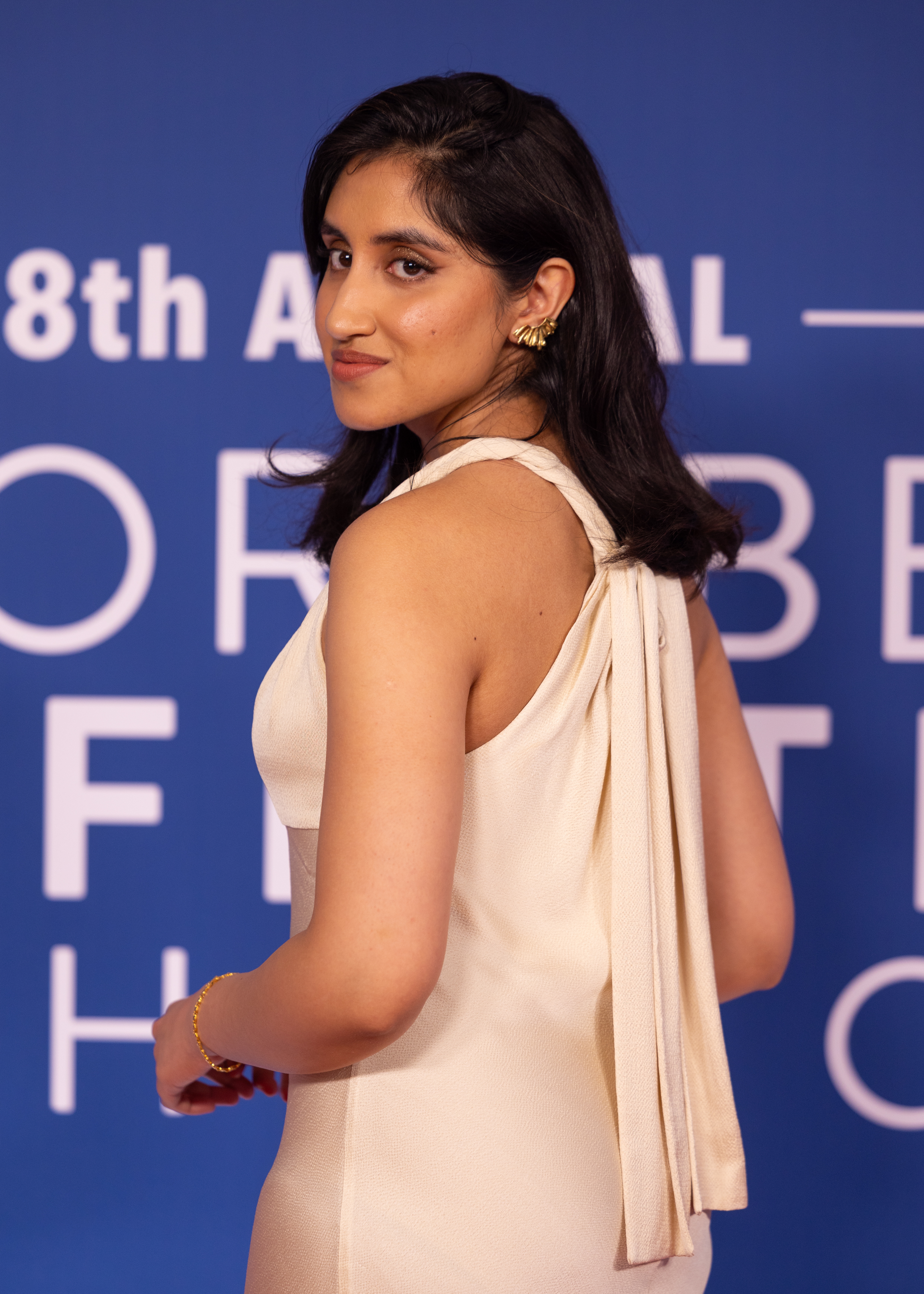 Ambika Mod in an elegant gown on a red carpet