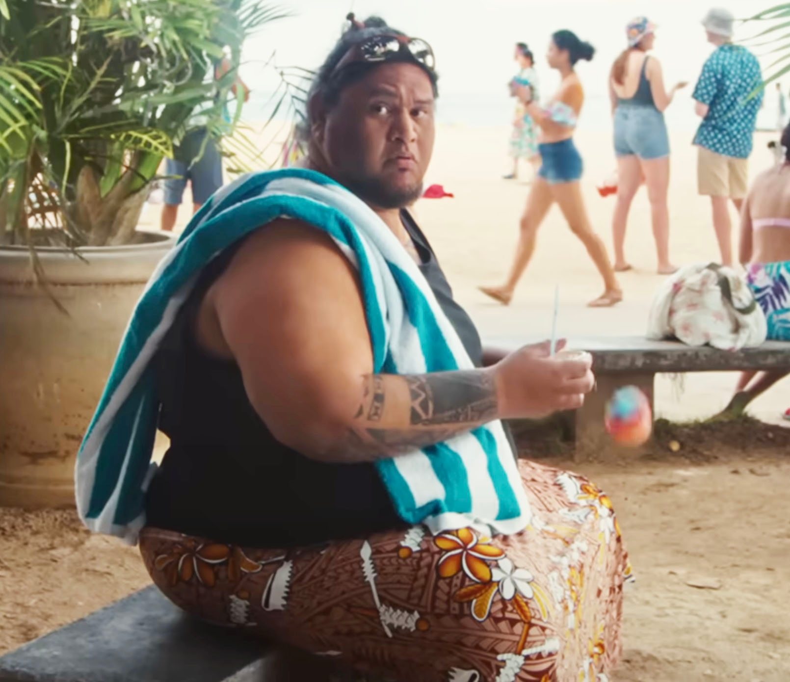 A guy dropping his shaved ice cone in a scene from the Lilo & Stitch live action remake