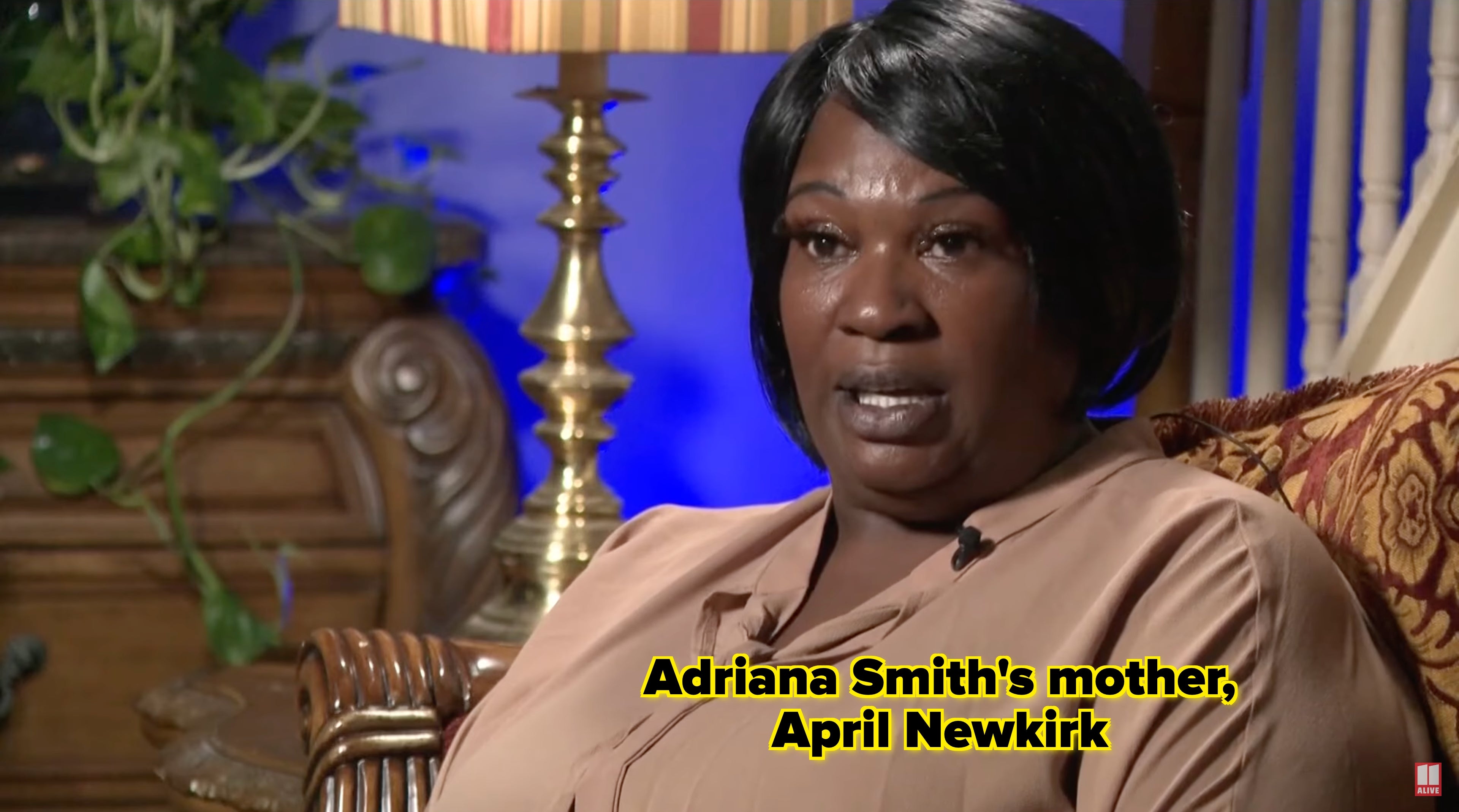 Woman speaking in an interview in a living room