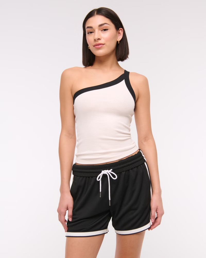 Model wearing the cream and black tank
