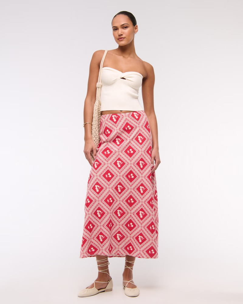 Model wearing the red cherry print skirt