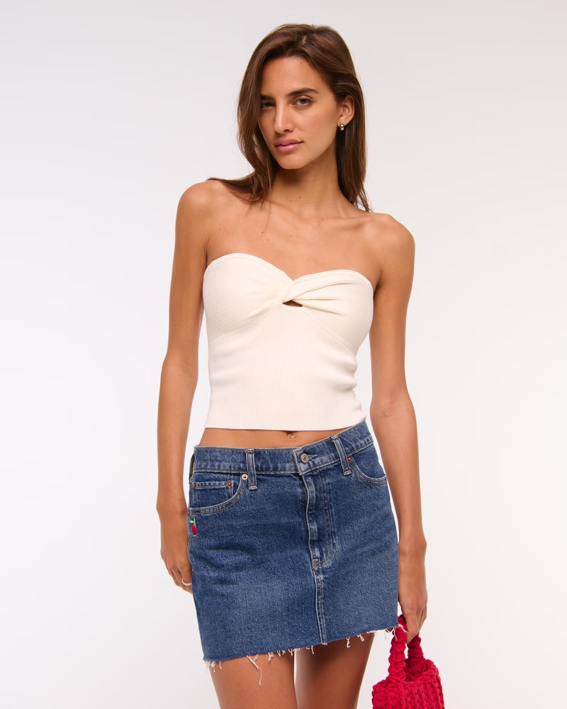 Model wearing the cherry denim skirt