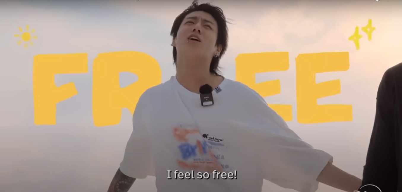 Person joyfully extends arms with eyes closed, wearing a casual white shirt. Text in the image says "FREE" and "I feel so free!"