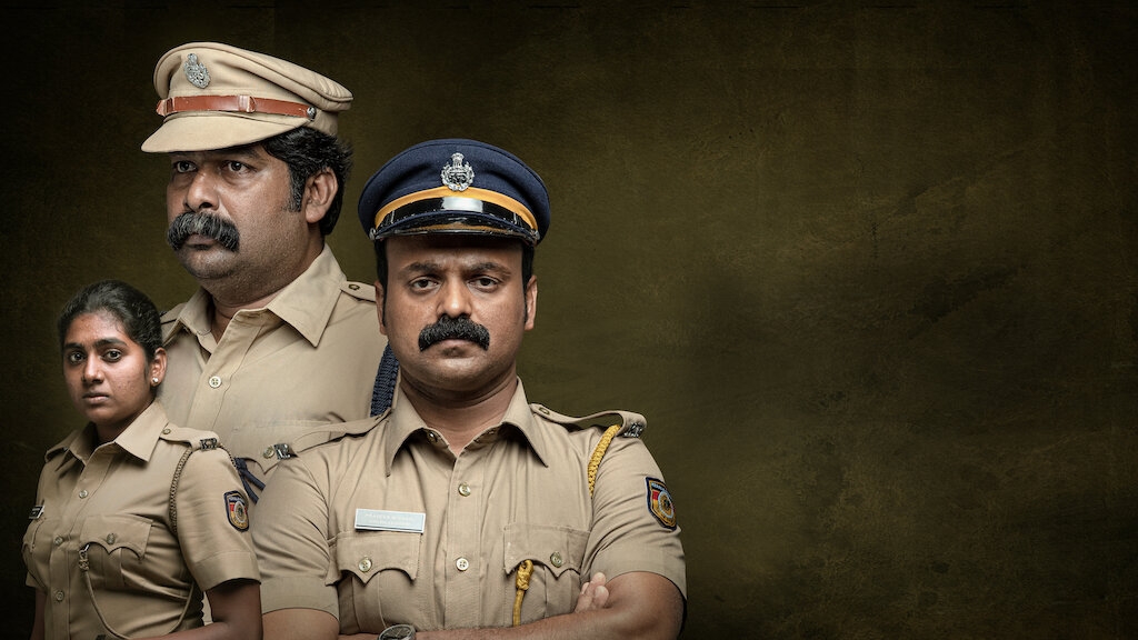 Three people in police uniforms stand against a dark background, displaying serious expressions