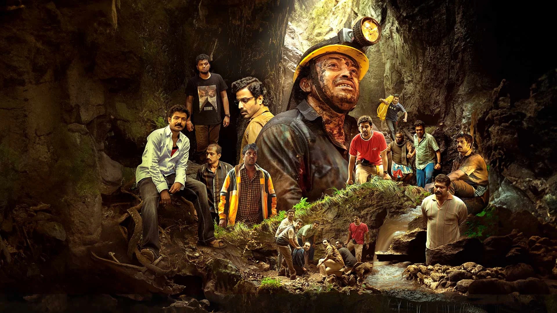 Scene from a movie depicting miners and various individuals in a rugged cave environment, highlighting intense emotions and drama