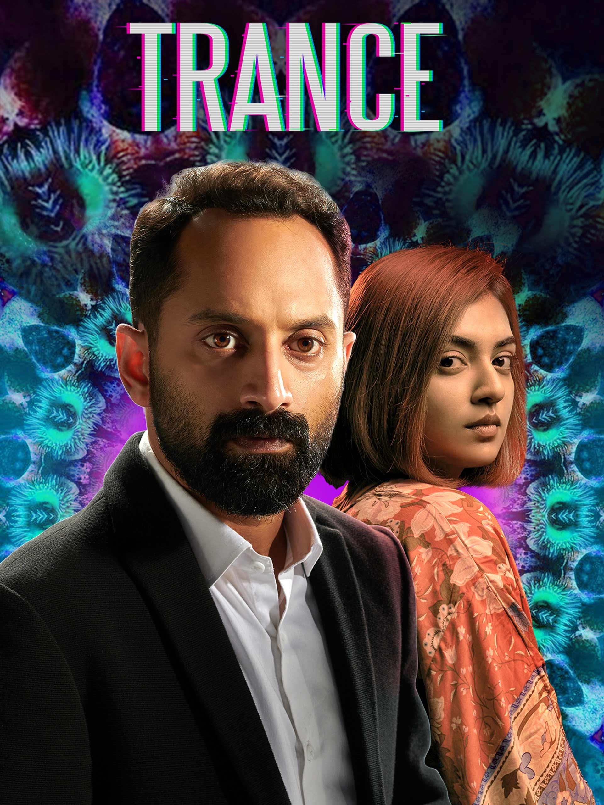 A man in a suit and a woman in patterned clothing stand against a psychedelic background, with the word "TRANCE" above them