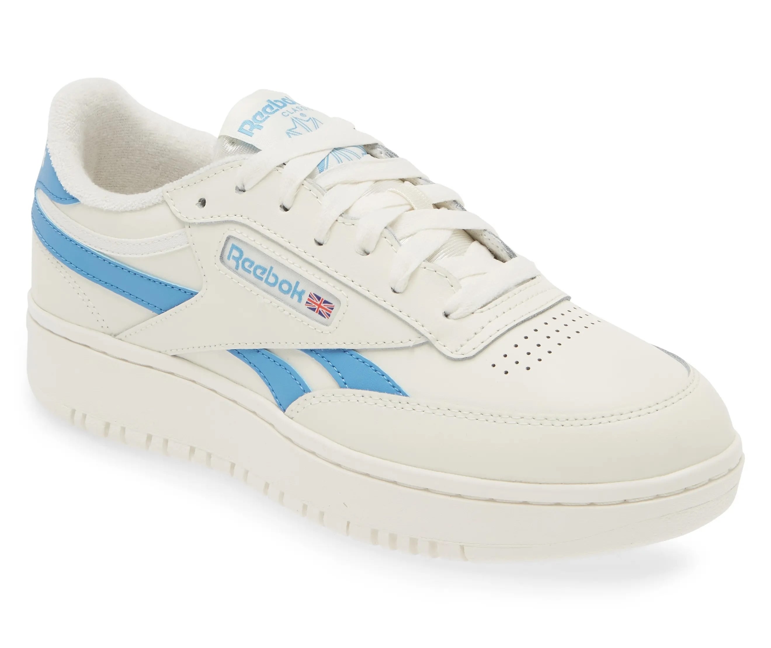 Reebok sneaker with blue accents, platform sole, and logo on side, positioned for a shopping article