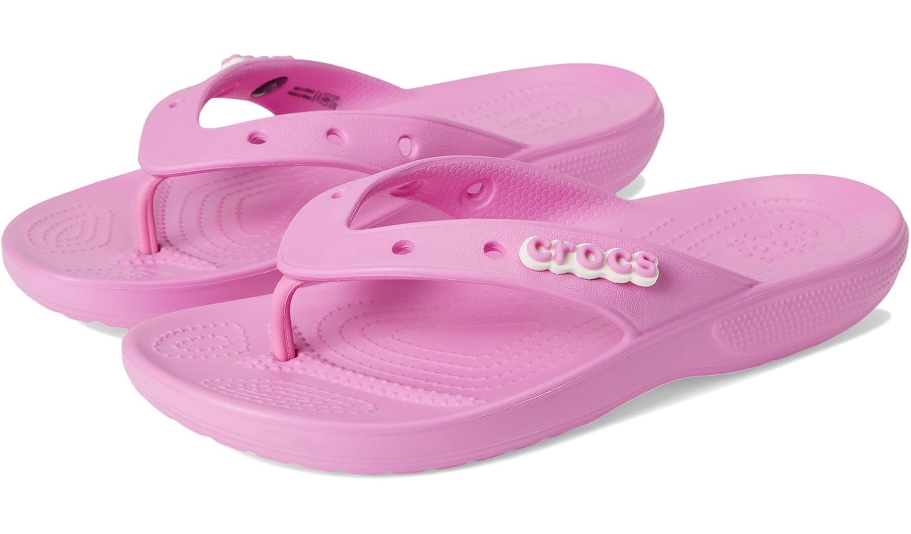 Pink Crocs flip-flops displayed on a plain background