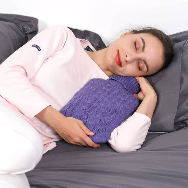 Model successful cozy loungewear rests connected a bed, hugging a textured blistery h2o bottle, highlighting a relaxation merchandise successful a buying context