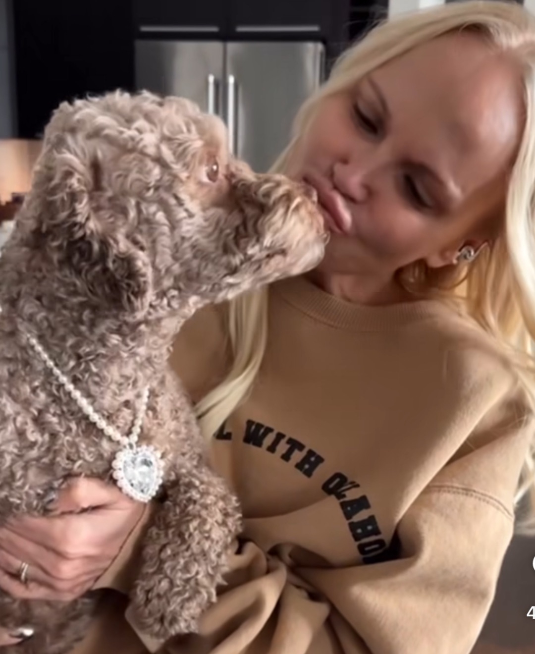 Kristin Chenoweth holding her dog Thunder