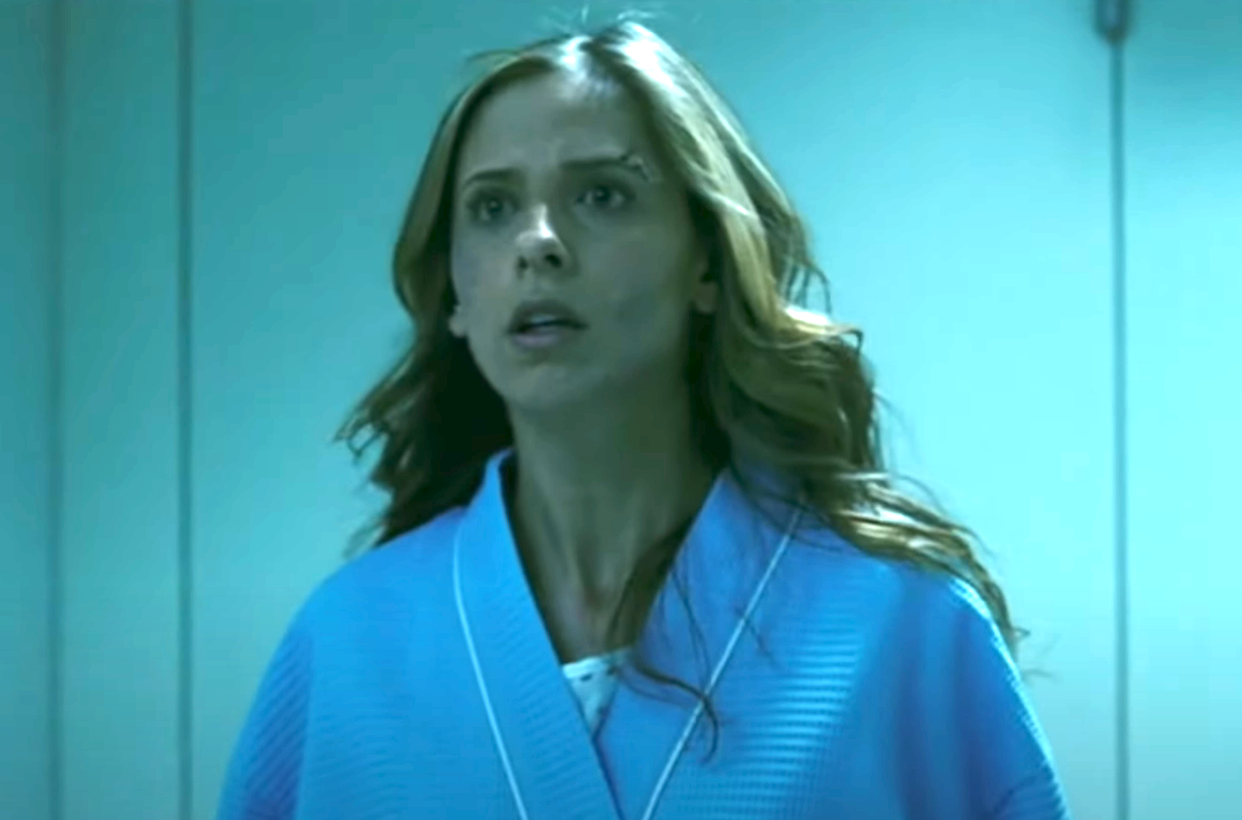 Karen in a hospital gown with loosely curled hair