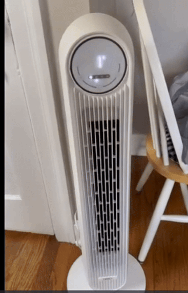 Tower instrumentality   lasting  connected  a hardwood level  adjacent  to a chair, perfect  for location  cooling and aerial  circulation
