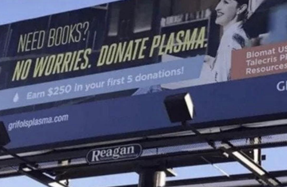 Billboard promotes plasma donation, offering $250 for the first five donations. Slogan: &quot;Need books? No worries. Donate plasma&quot;