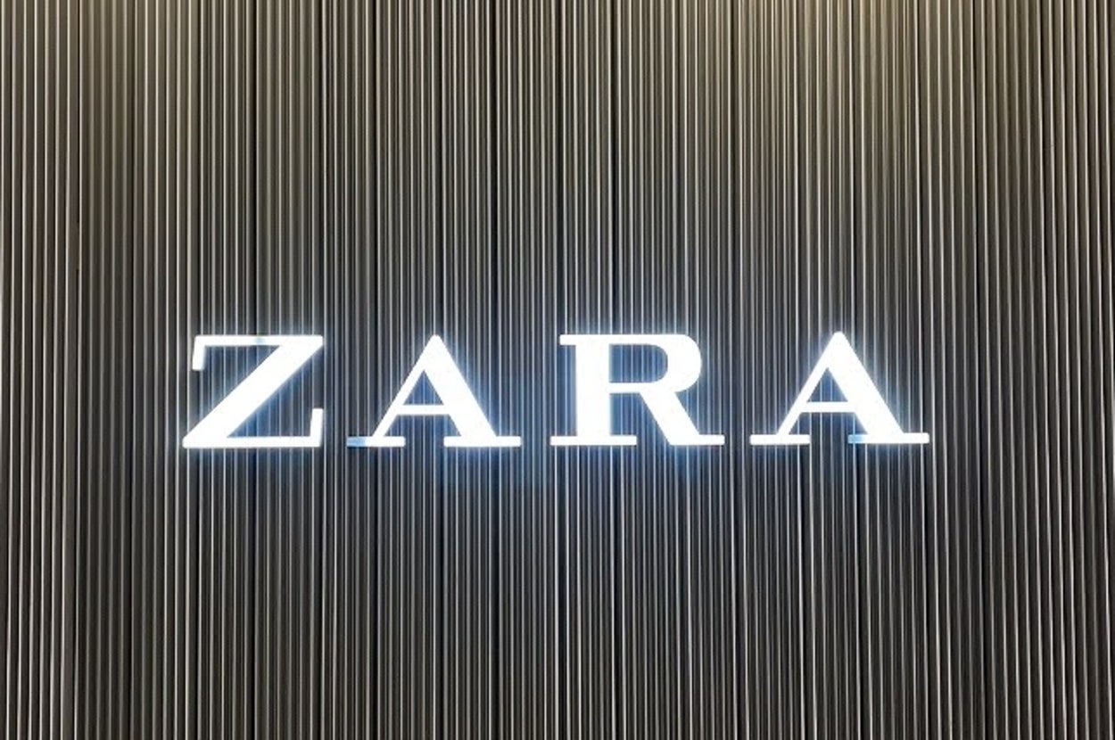 Zara store sign on a vertically-lined wall