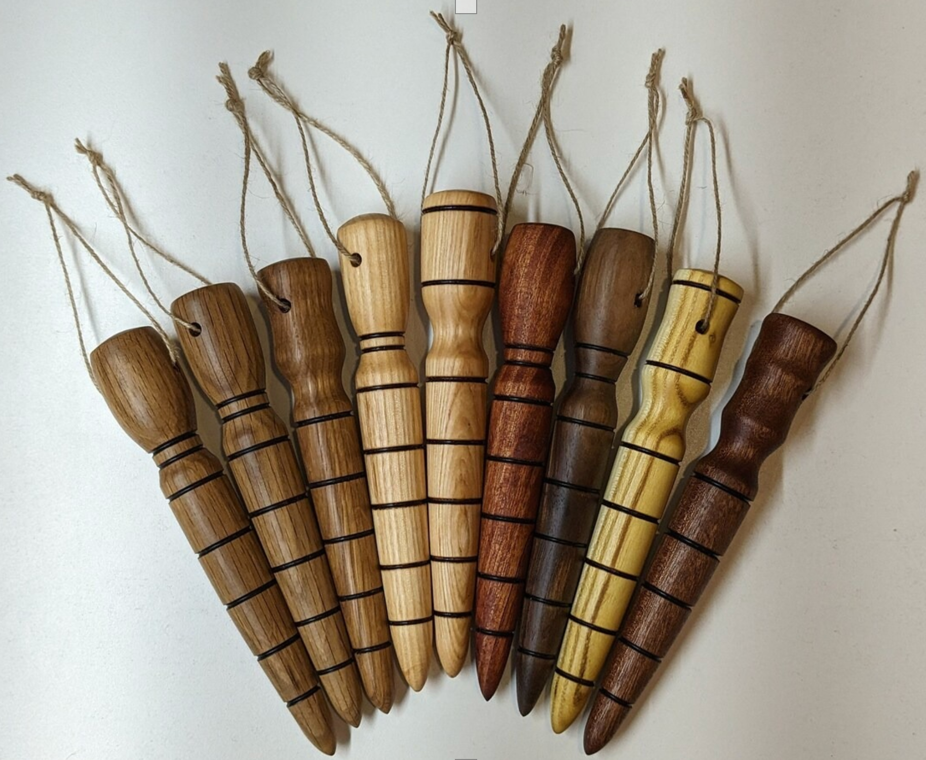 Wooden honey dippers with grooves and string loops