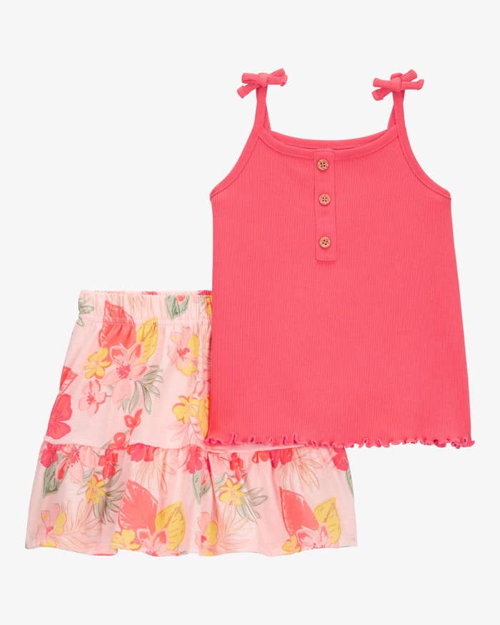 Sleeveless pinkish  apical  with fastener  item  paired with a floral tiered skirt, styled for a summery, casual look