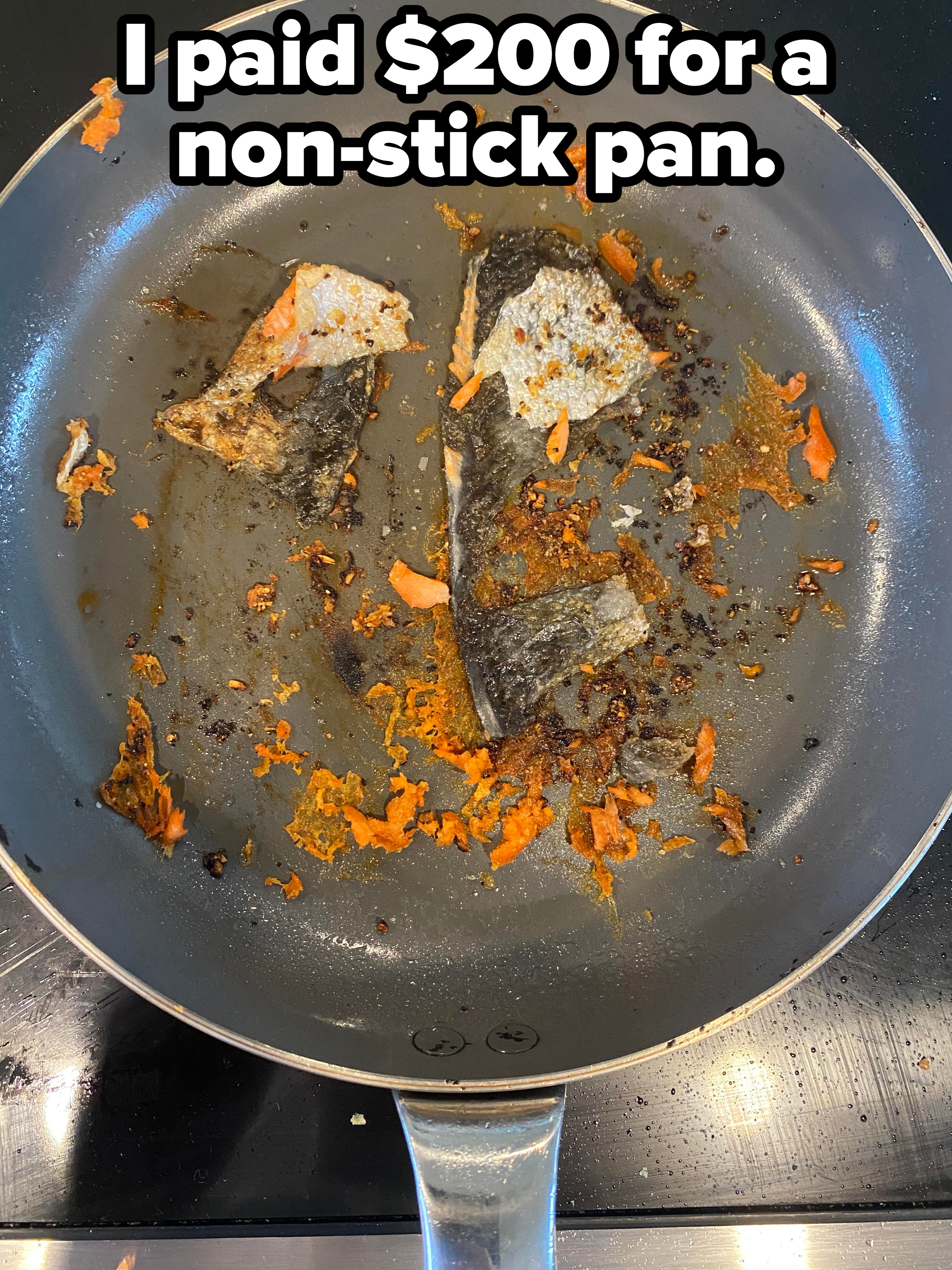 Fried fish skin remnants and scraps in a frying pan, showing signs of cooking and seasoning