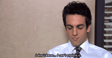 Man in an office setting looks down and to the side, saying, &quot;I don&#x27;t know... I can&#x27;t explain it.&quot; His expression is contemplative