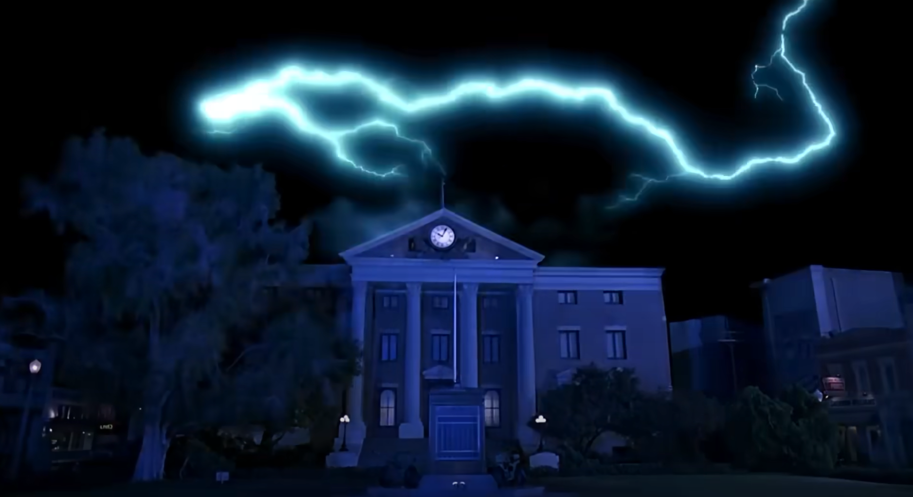 A lightning bolt strikes the clock tower of a courthouse at night, reminiscent of a famous scene from a classic time-travel movie