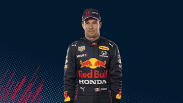 Race car driver in Red Bull Honda racing suit and cap, gesturing thumbs up with both hands