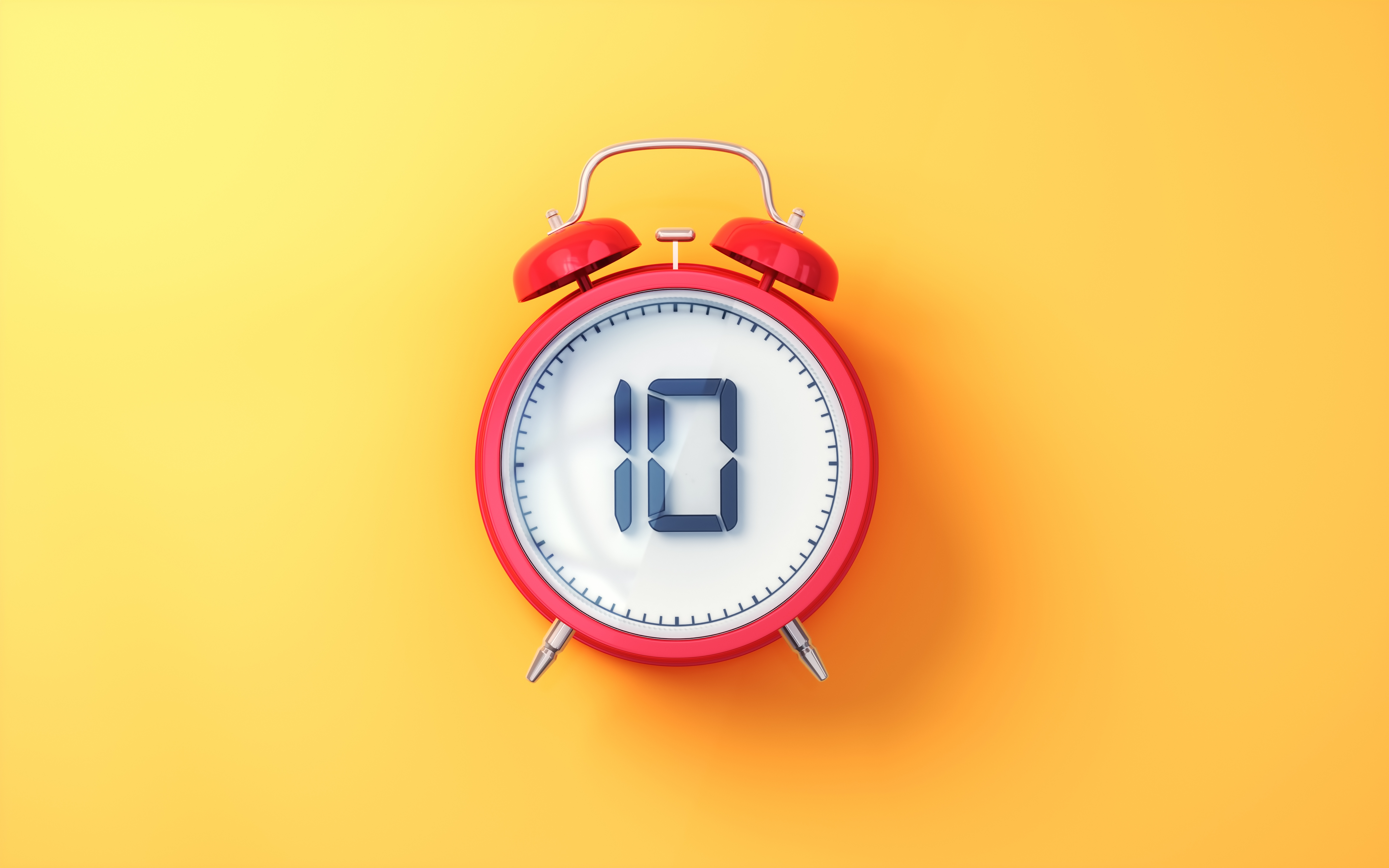 Analog klokke med en rød ramme på gul bakgrunn, og viser tiden som 10:10