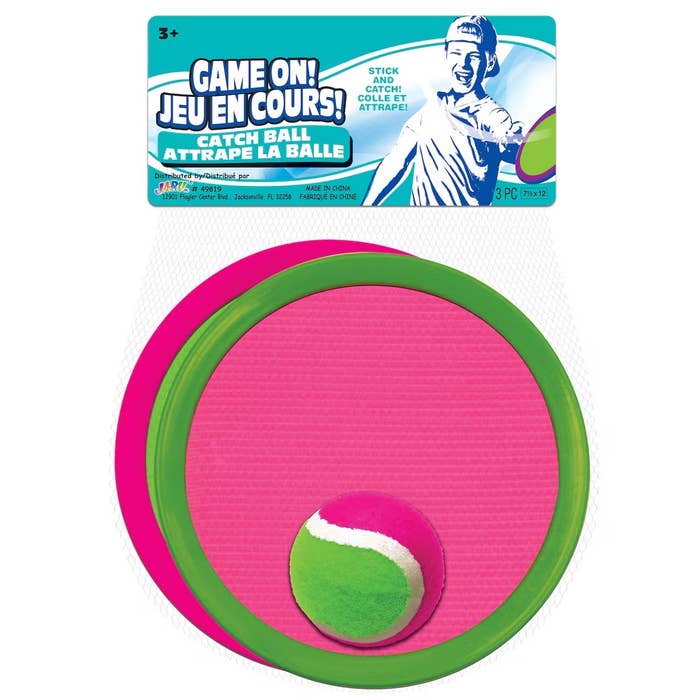 Catch shot  acceptable   with a pinkish  and greenish  design, suitable for ages 3 and up, featuring a velcro pad and shot  for casual  play