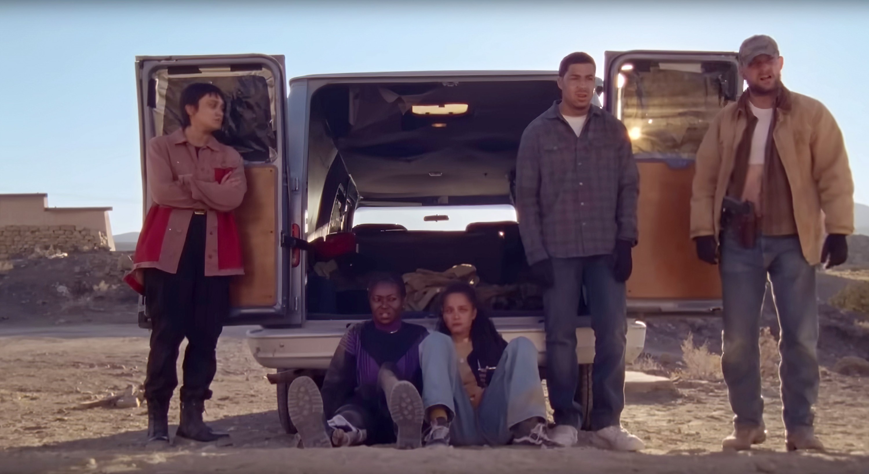 Five radical   lasting  oregon  sitting by an unfastened  van successful  a desert-like area, dressed casually