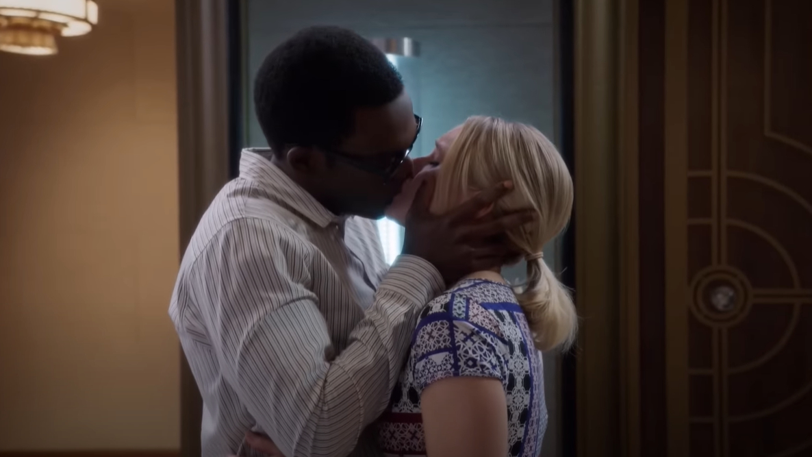 Eleanor and Chidi kiss, his hands grasping the sides of her face