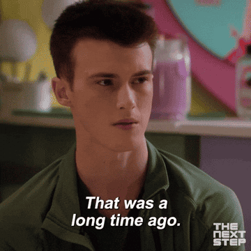 A person is speaking with a serious expression, text on screen reads, &quot;That was a long time ago.&quot;