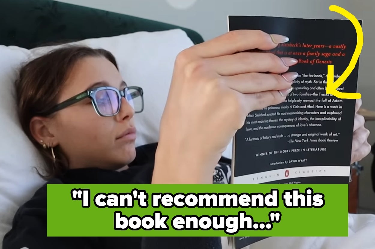 Person lying in bed reading a book with a highlighted review saying, "I can't recommend this book enough..."