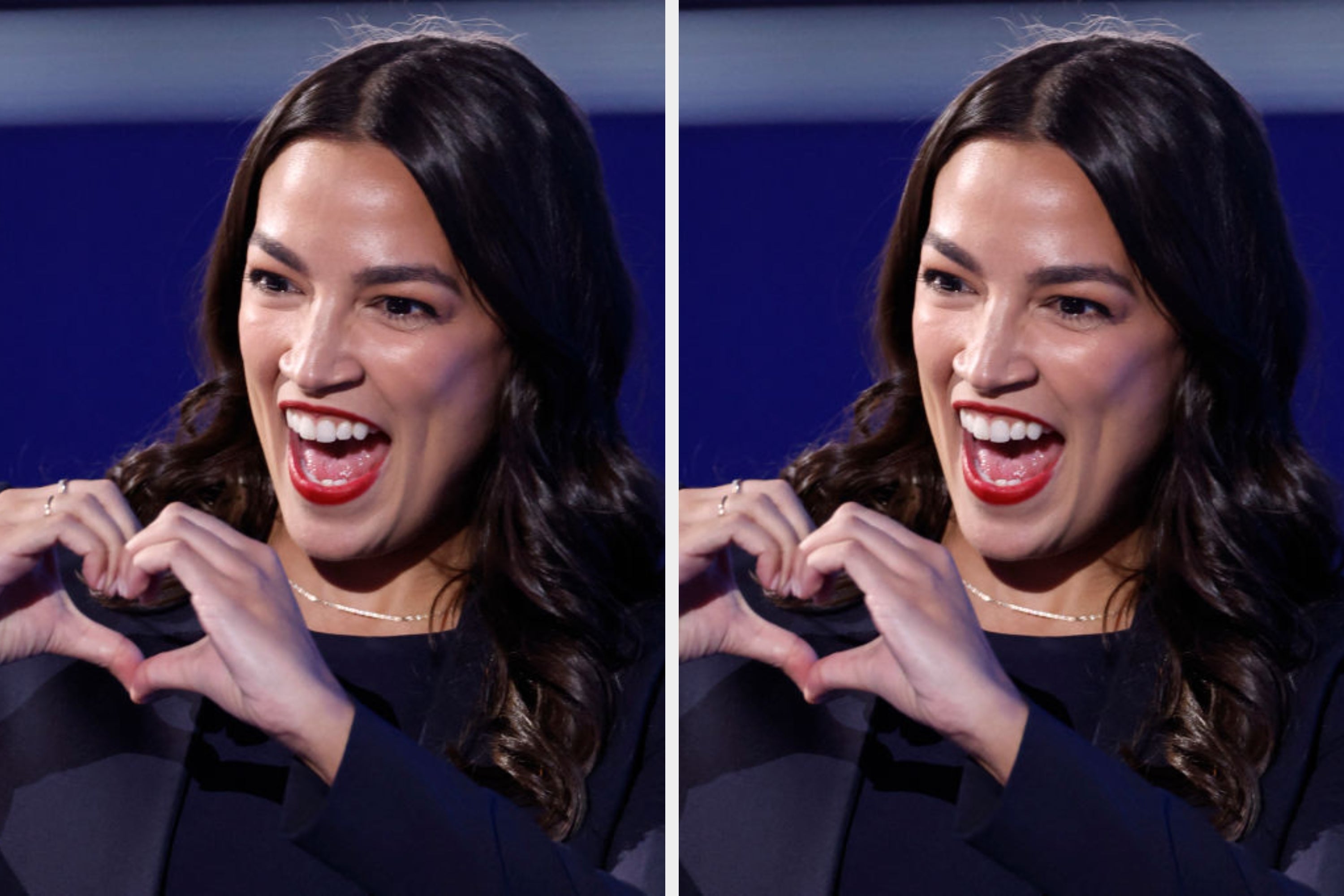 AOC enthusiastically making a heart shape with their hands, smiling widely during a public event