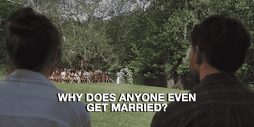 A couple sits watching a wedding ceremony from a distance. Text on the image reads, &quot;Why does anyone even get married?&quot;