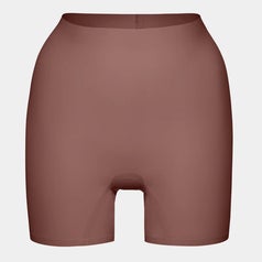 Short, seamless shapewear shorts displayed against a plain background, highlighting their smooth texture and form-fitting design