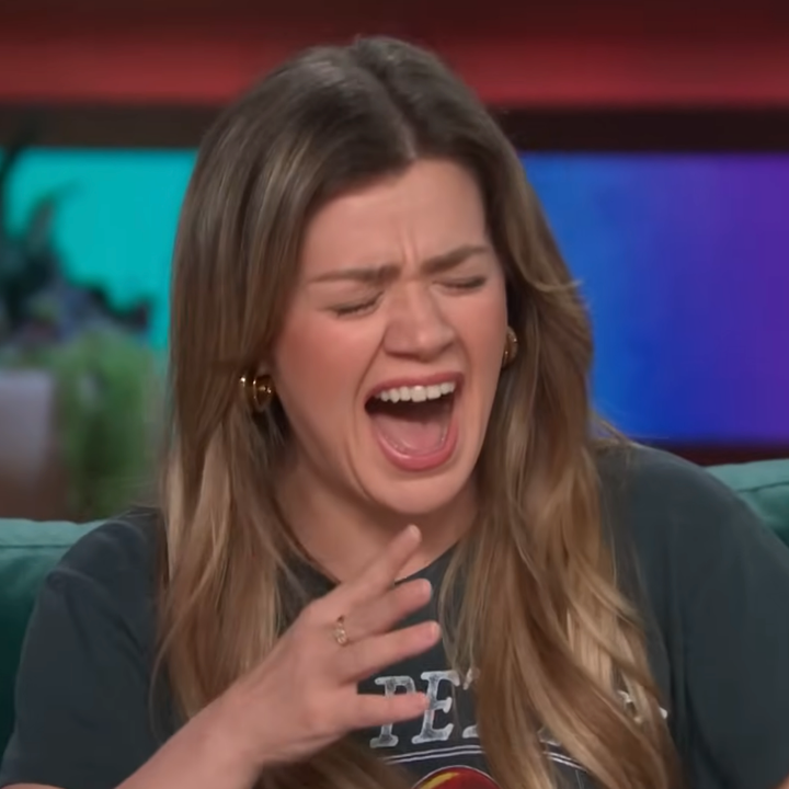 Kelly Clarkson mid-laughter on her talk show
