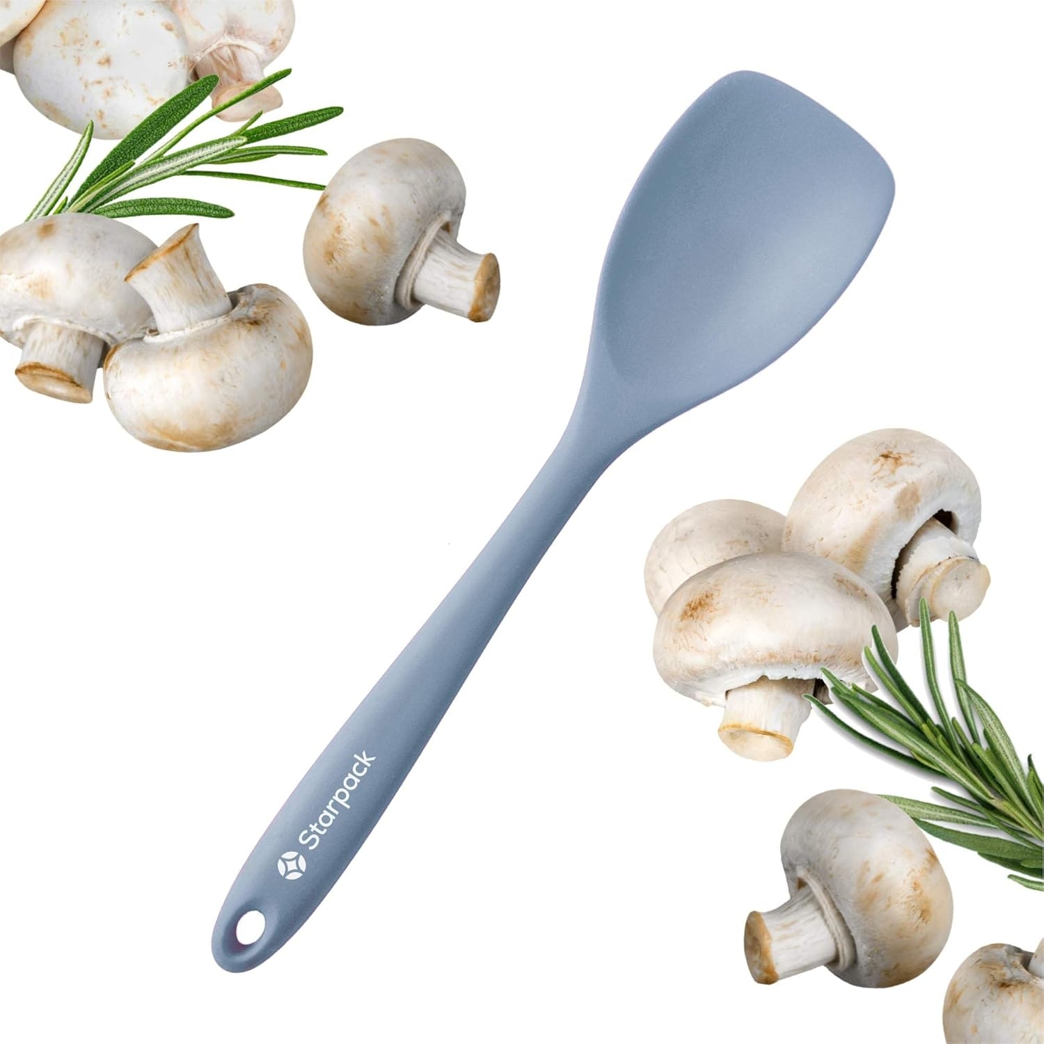 Silicone spoonula with a smooth design, surrounded by mushrooms and rosemary sprigs