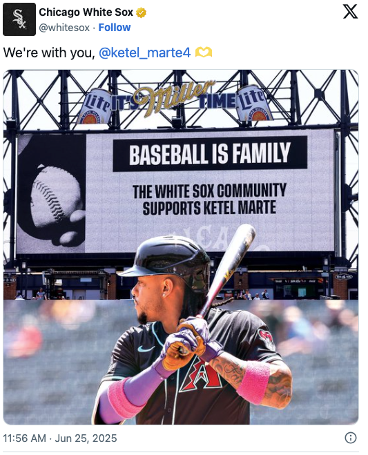 Baseball player with bat ready to swing. Stadium sign says, &quot;Baseball is Family. The White Sox community supports Ketel Marte.&quot;