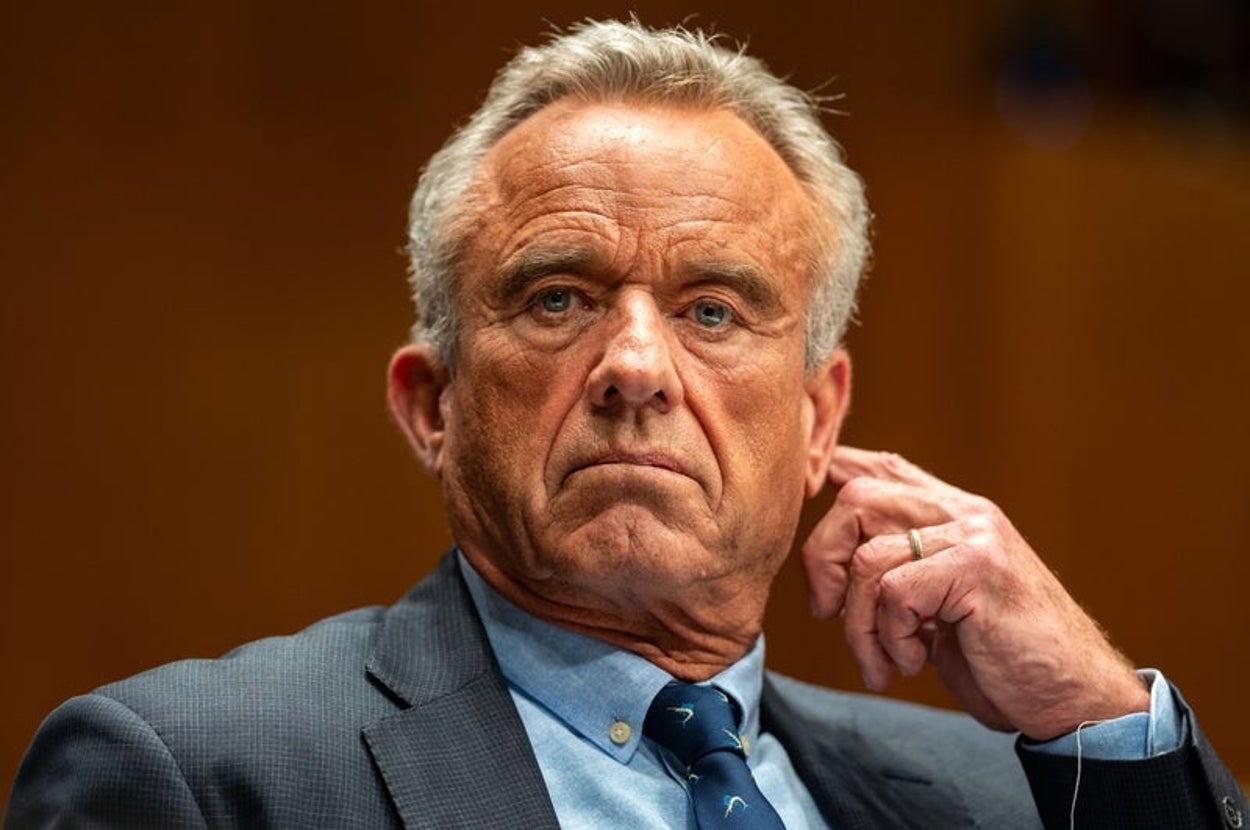 I don't know who this is, but the person is wearing a suit and tie, seated with a thoughtful expression