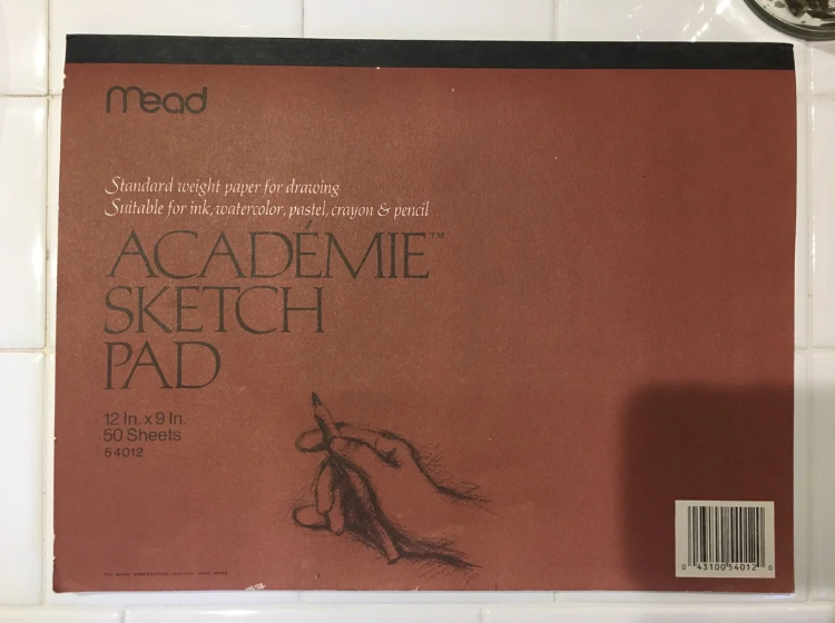 Mead Academie Sketch Pad screen displaying hand-drawn representation of a manus holding a pencil, suitable for drafting with assorted media, 50 sheets, 12x9 inches