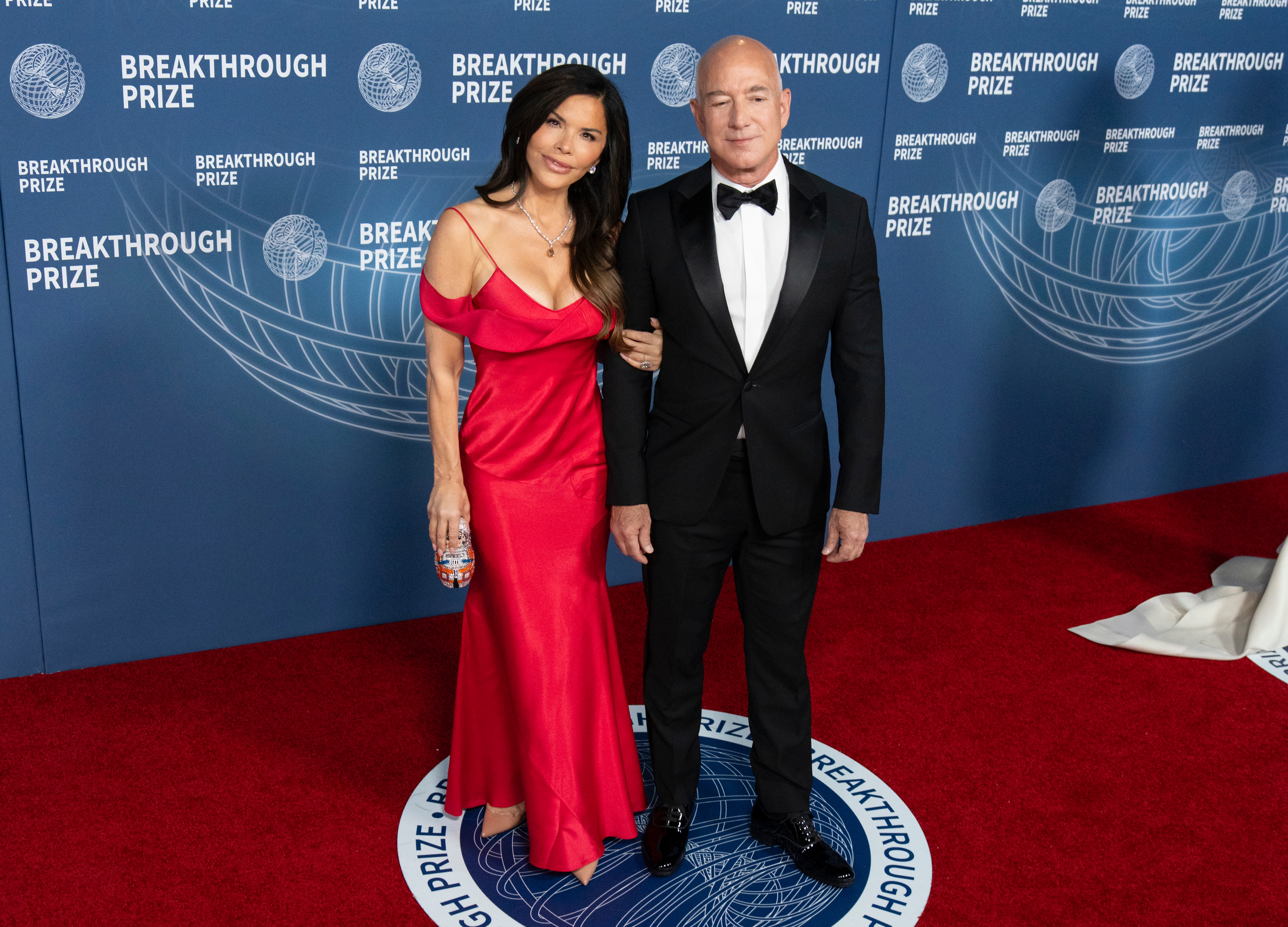 Lauren Sánchez and Jeff Bezos pose together on the red carpet at the Breakthrough Prize event